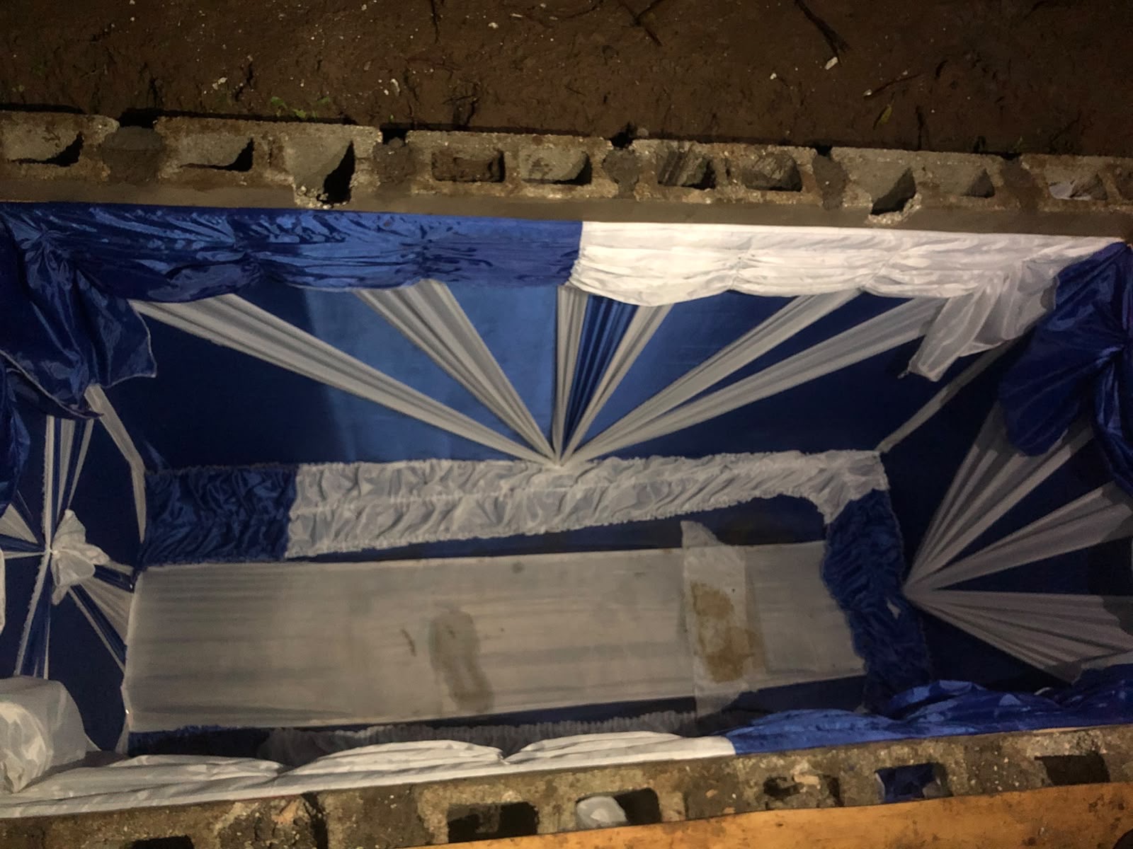 A blue and white draped vault
